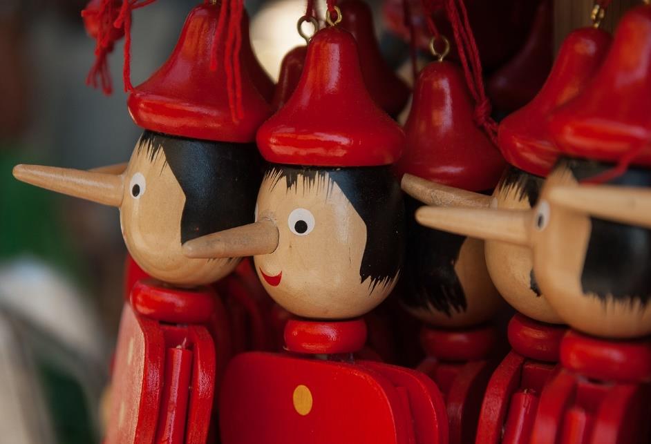 A group of wooden Pinochio dolls.