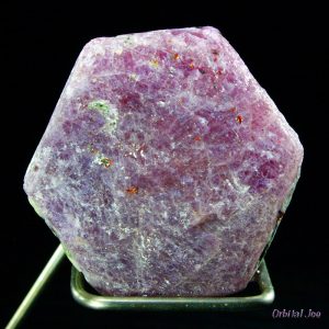 This mineral is 6-sided an reddish-purple. It can also be blue.