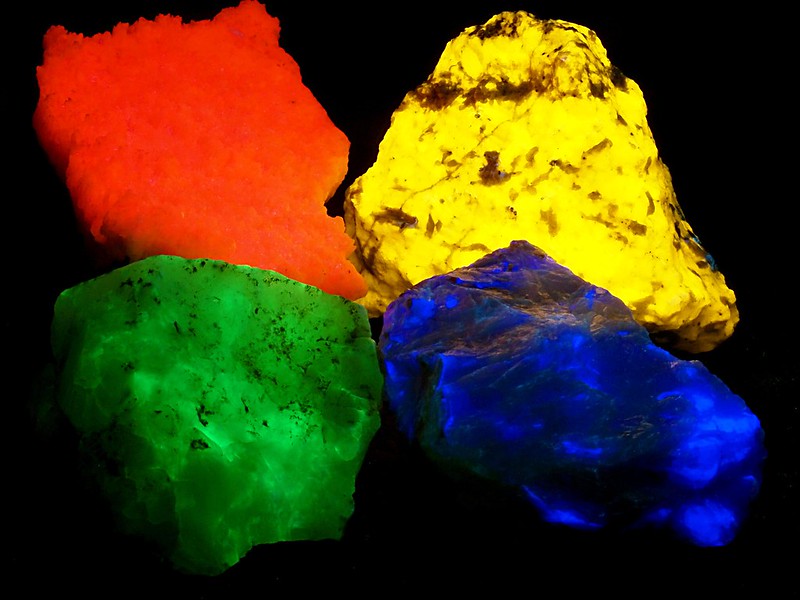 Minerals glowing bright, neon colors under UV light, or "fluorescing"