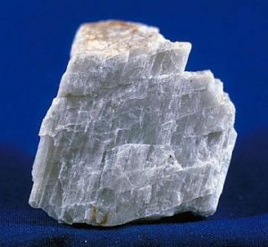 Albite feldspar demonstrating 2-directional cleavage planes at non-90 angles