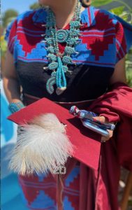 Image showing a young woman graduating from school in her traditional Navajo clothes