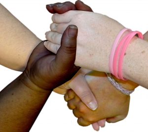 Diverse people holding hands