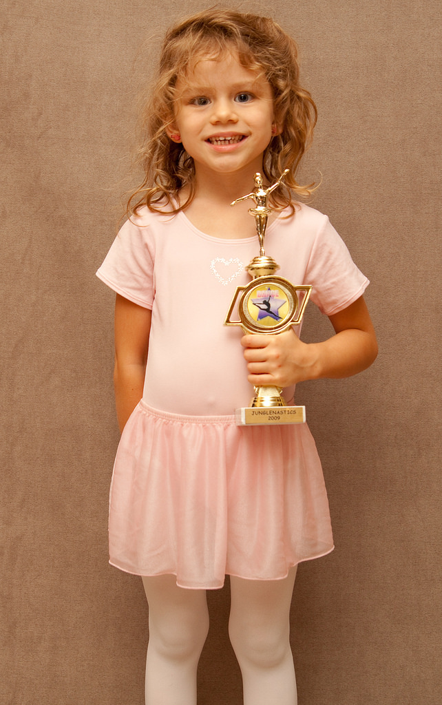 Little girl with a trophy