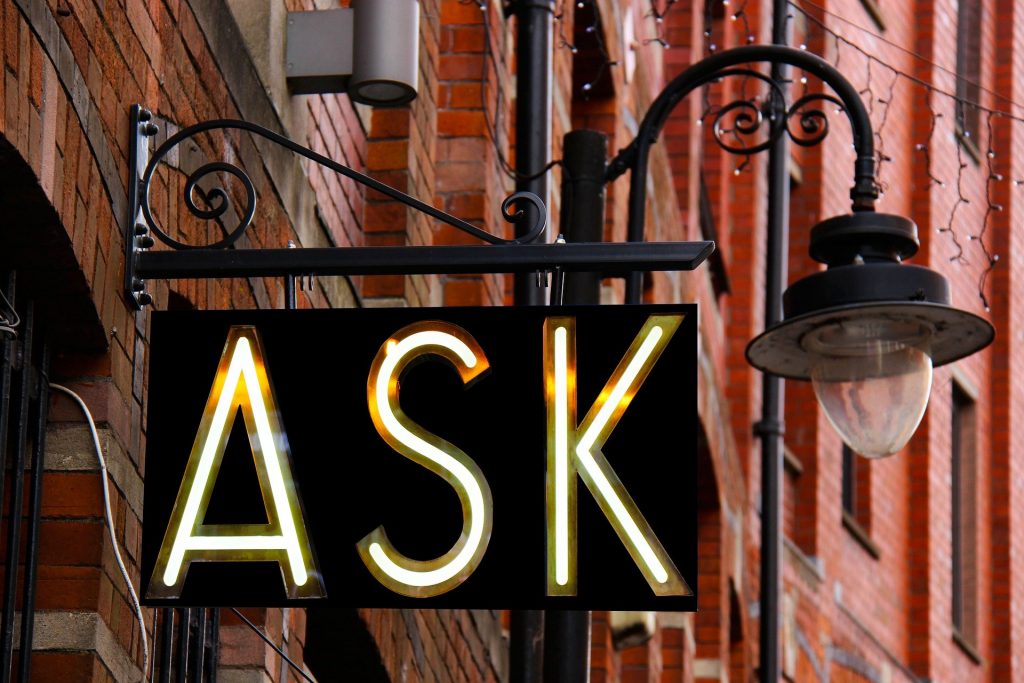A sign with the word ask on it
