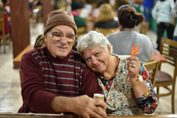 two older adults smiling for photo sitting