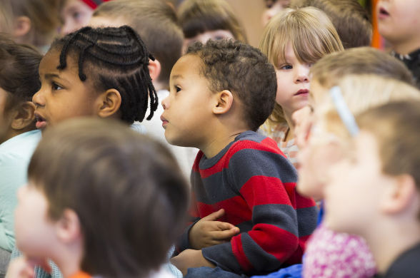 group of young children that are diverse looking sitting