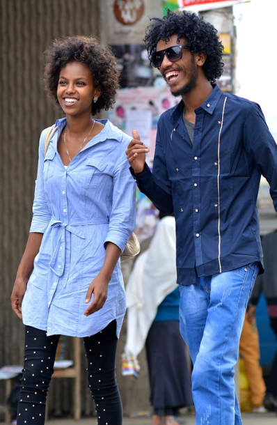 two young African American adults walking