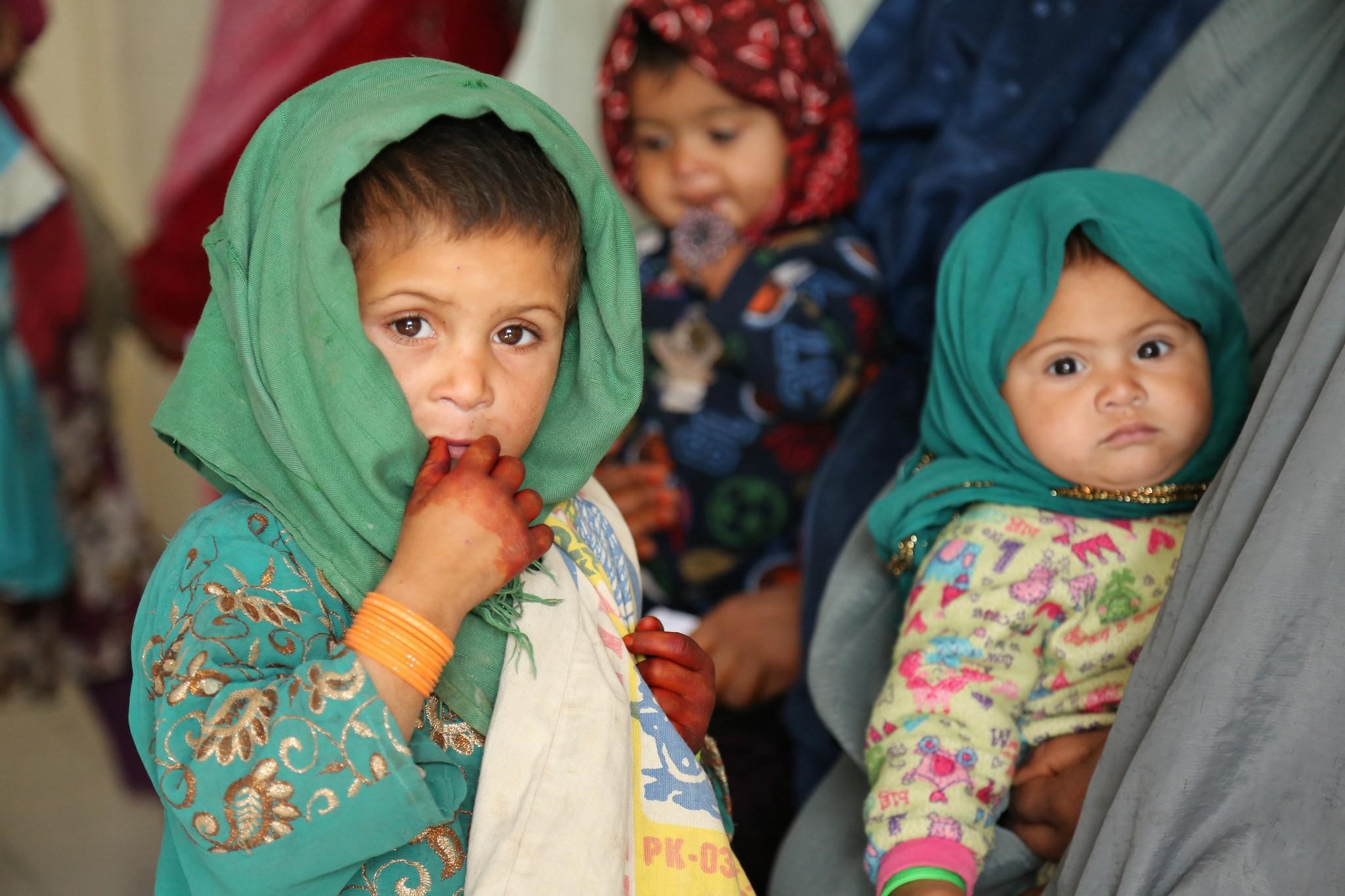 three children with head covers