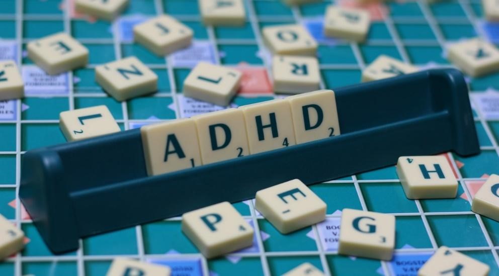 letters A -D - H - D on a scrabble board