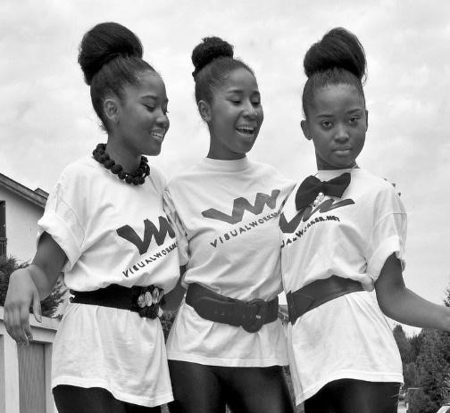 black and white photo of 3 teens with hair buns and matching outfits