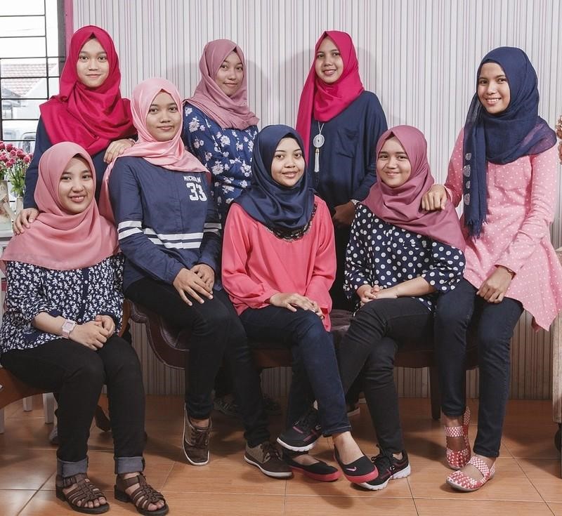 group of 8 teens wearing hijab head covers