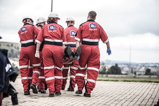 group of rescue team carrying a person