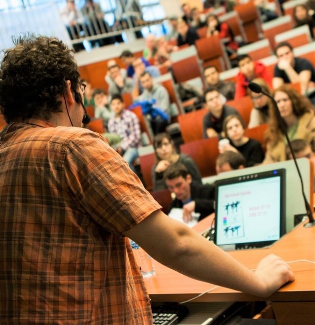 classroom lecture hall with speaker at the front