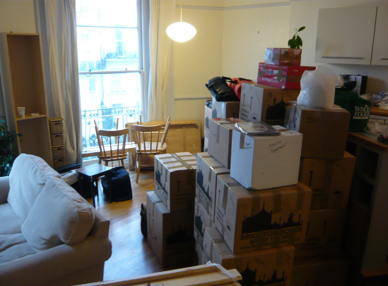 living room with filled with moving boxes