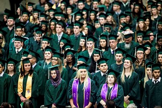 group of college students wearing regalia for commencement