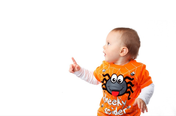 toddler pointing up and looking to the side