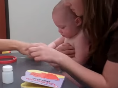 mother and infant in lab sitting at table