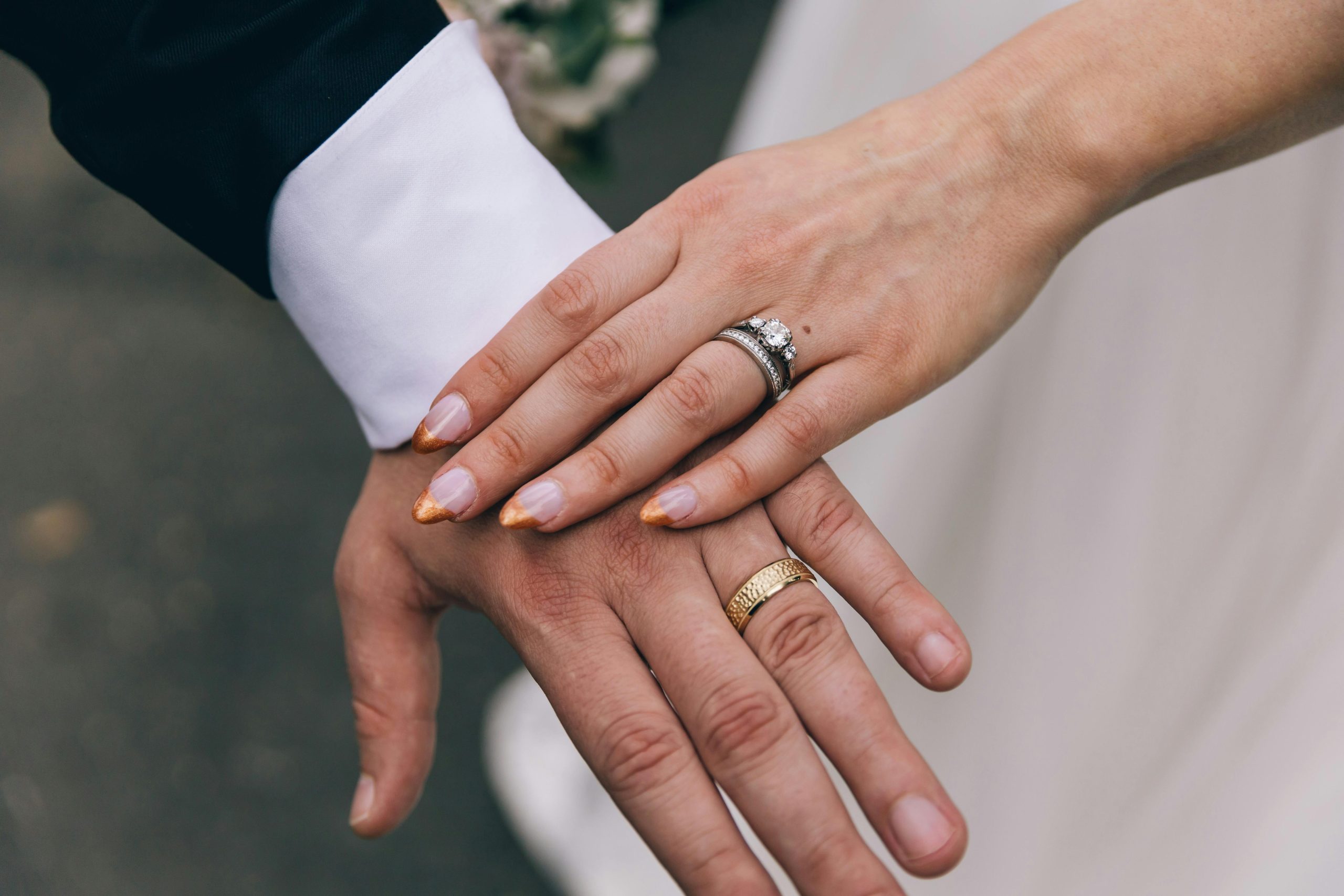 A Couple Wearing their Wedding Rings