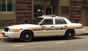 A photograph of a police car in the street.