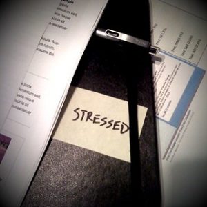 Notebook with the word stressed written on it