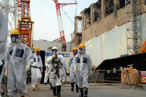 Workers in biohazard suits at the site of the Fukushima nuclear disaster