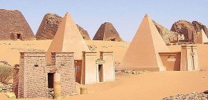Replications of Nubian pyramids are in front of the ancient ruins of Nubian temples.