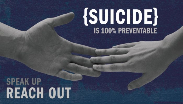 Two hands are touching and the image reads Suicide is 100% Preventable; Reach out