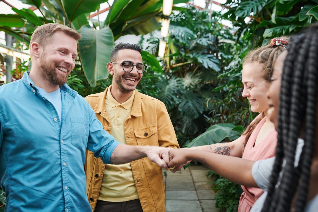 Photo Of People Having Fist Bump