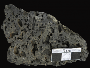Scoria interactive model. Scoria is a dark-colored rock with holes where gases have previously escaped.