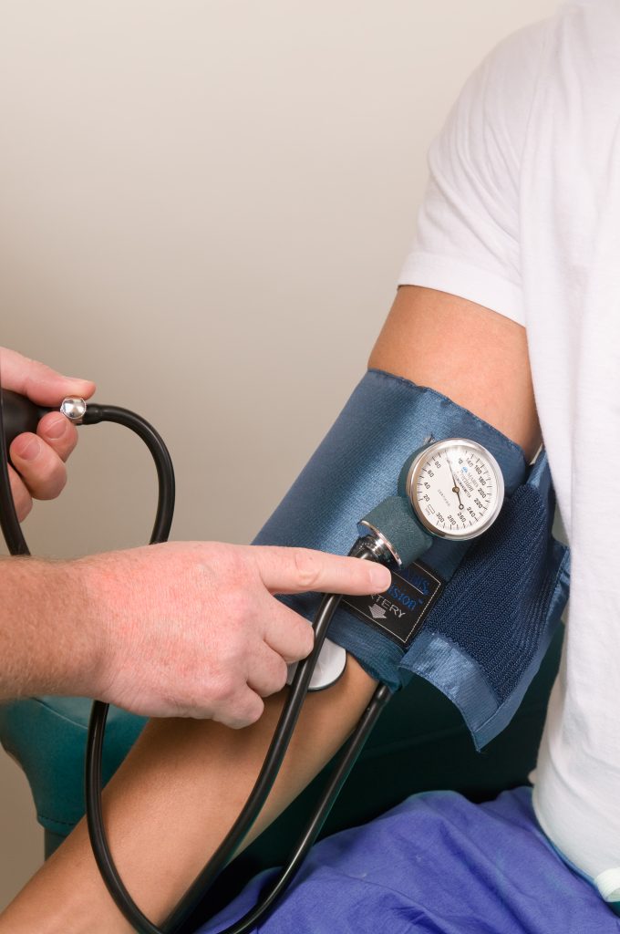 Blood pressure measurement on a man’s right hand