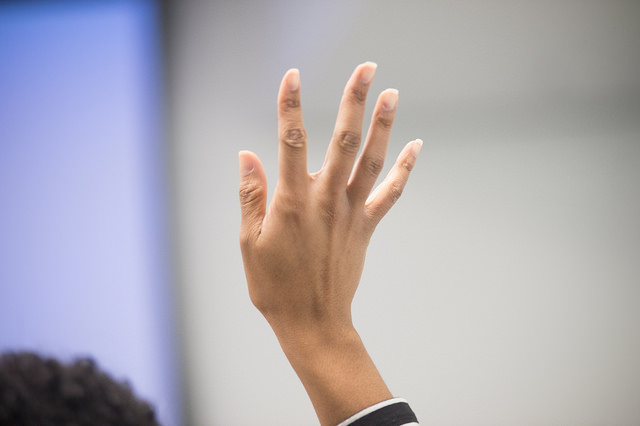 Person holding up hand