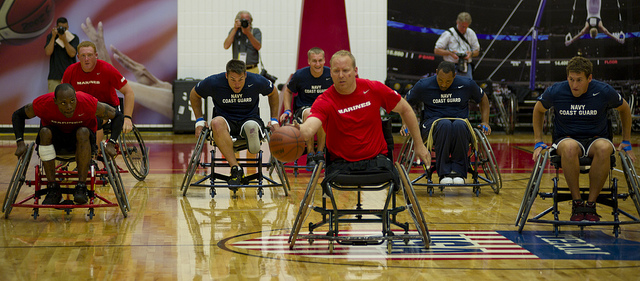 Men in wheelchairs playing basketball