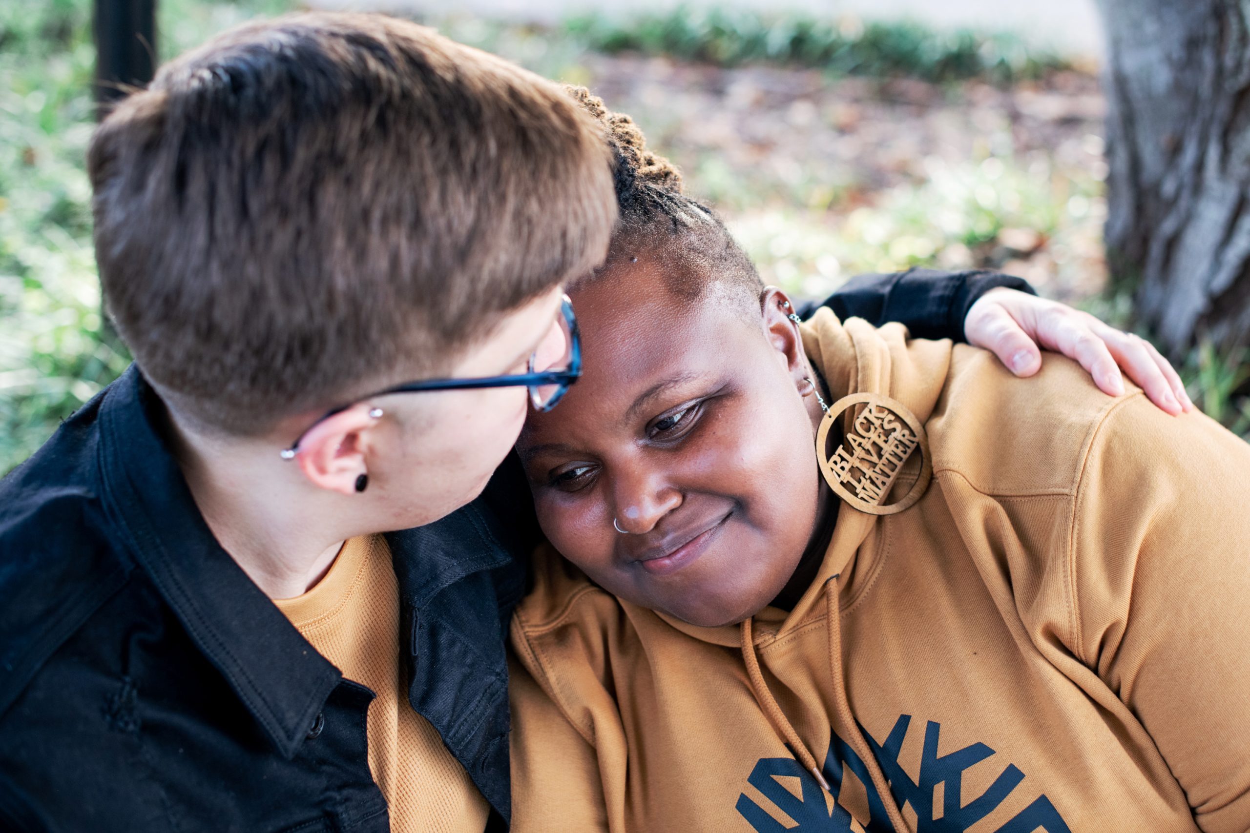 lesbian couple in comforting hug