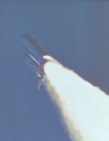 An image of the solid rocket booster leaking fuel, seconds before the explosion. The small flame visible on the side of the rocket is the site of the O-ring failure. By NASA (Great Images in NASA Description) [Public domain], via Wikimedia Commons