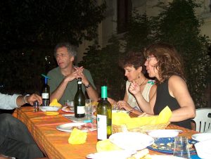 a family eating dinner and conversing