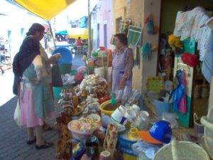 a couple bargains for goods in a market