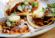 loaded tortillas on a white plate