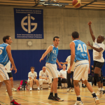 young men playing basquetball