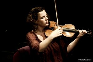 photo of a woman playing a violin