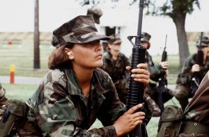 photo of a female soldier holding a rifle