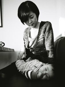 photo of a mother holding her infant child