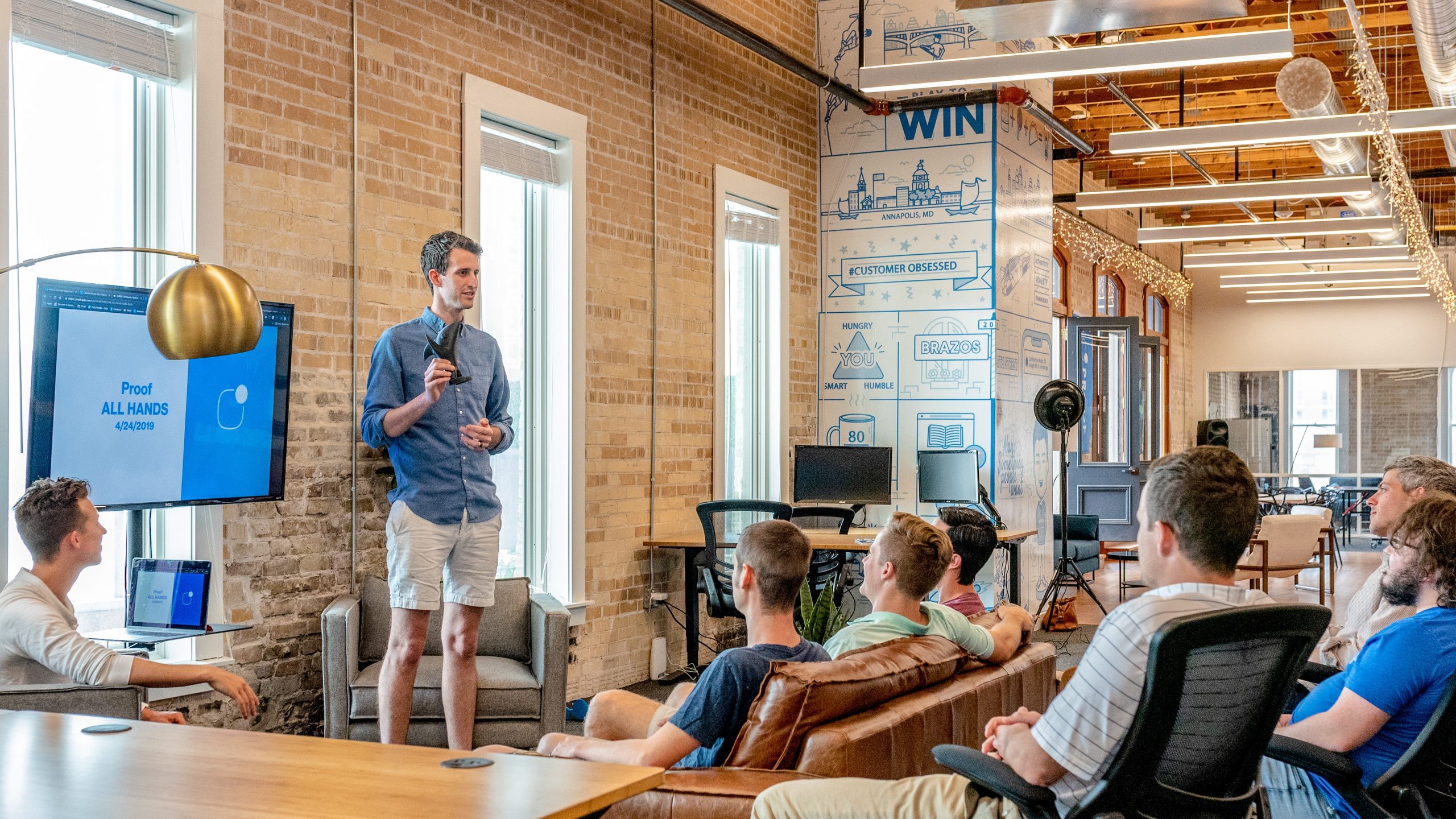 A man giving a presentation to a small audience.