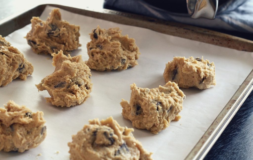 Some cookie doughs are on the tray ready to bake.