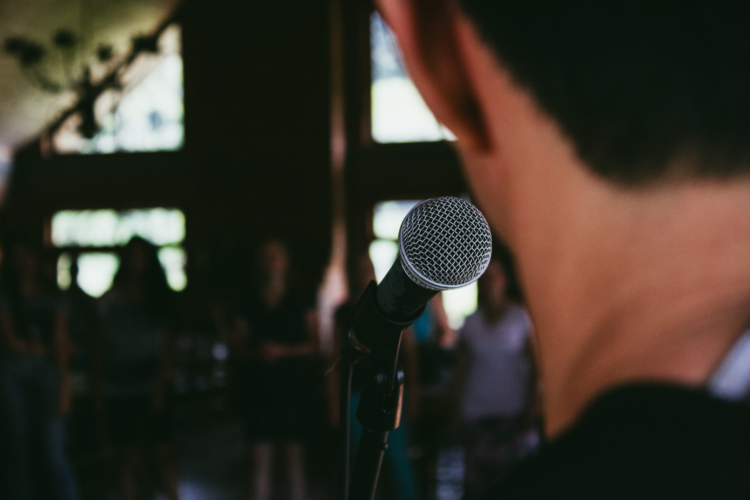 A man standing in front of the microphone