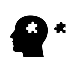 Clip art of a silhouette of a head with a space for a puzzle piece in the middle, and a puzzle piece to the right of the head.