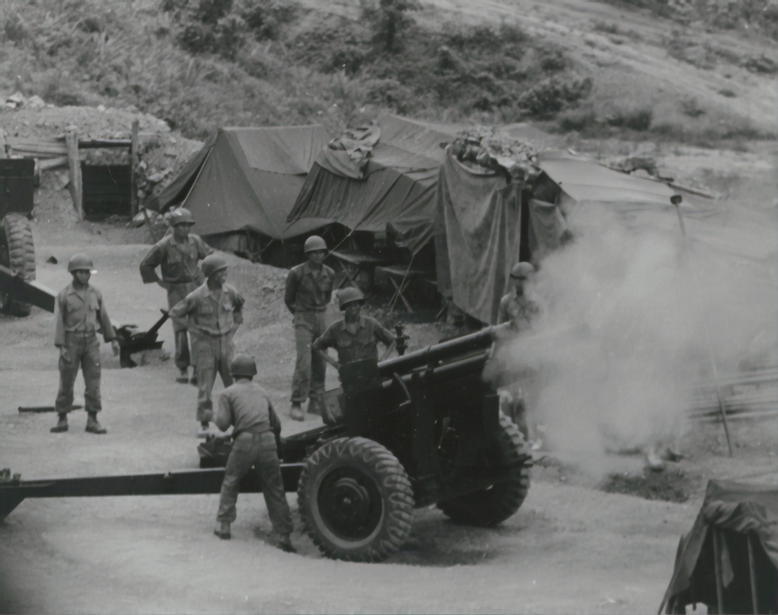 Vietnamese artillerymen fire from a mountain position during field training