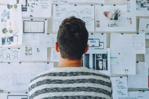 Man looking at planning board