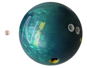 a bowling ball positioned next to a penny depicting the difference in masses of protons and neutrons versus an electron