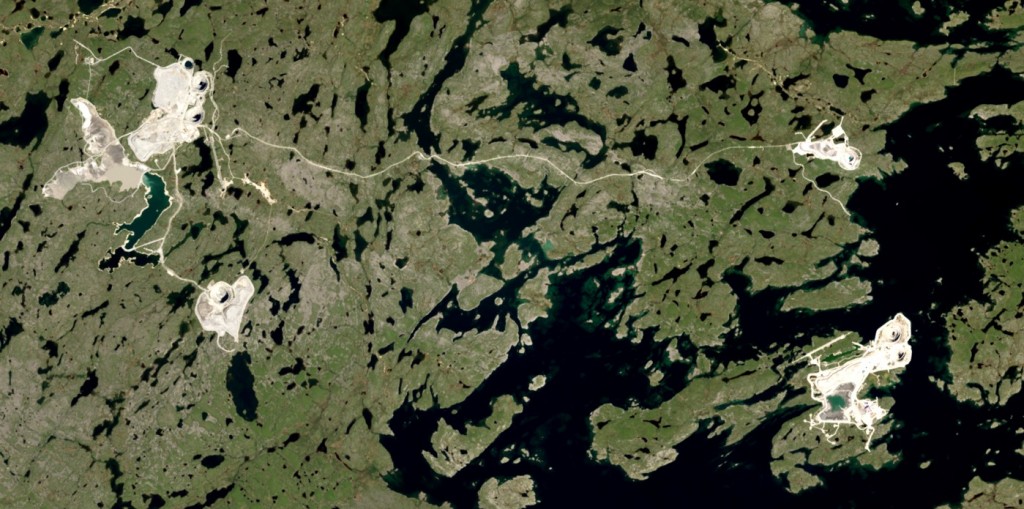 Figure 20.25 Diamond mines in the Lac de Gras region, Nunavut. The twin pits of the Diavik Mine are visible in the lower right on an island within Lac de Gras. The five pits of the Ekati mine are also visible, on the left and the upper right. The two main mine centres are 25 km apart. [http://earthobservatory.nasa.gov/IOTD/view.php?id=84085&src=eoa-iotd]