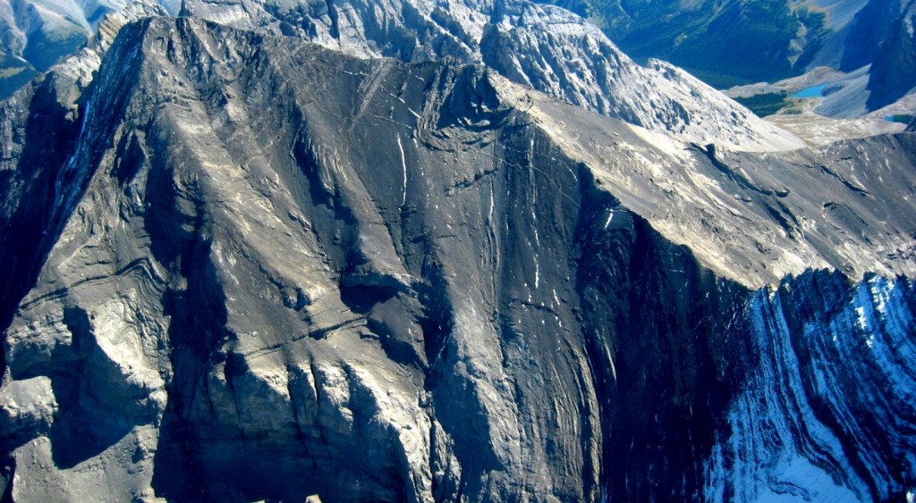 Figure 21.17 Folding of sedimentary rocks at Mt. Rae, Alberta. [https://upload.wikimedia.org/wikipedia/commons/e/e5/Mt-Rae-Alberta-Canada-aerial1.jpg]